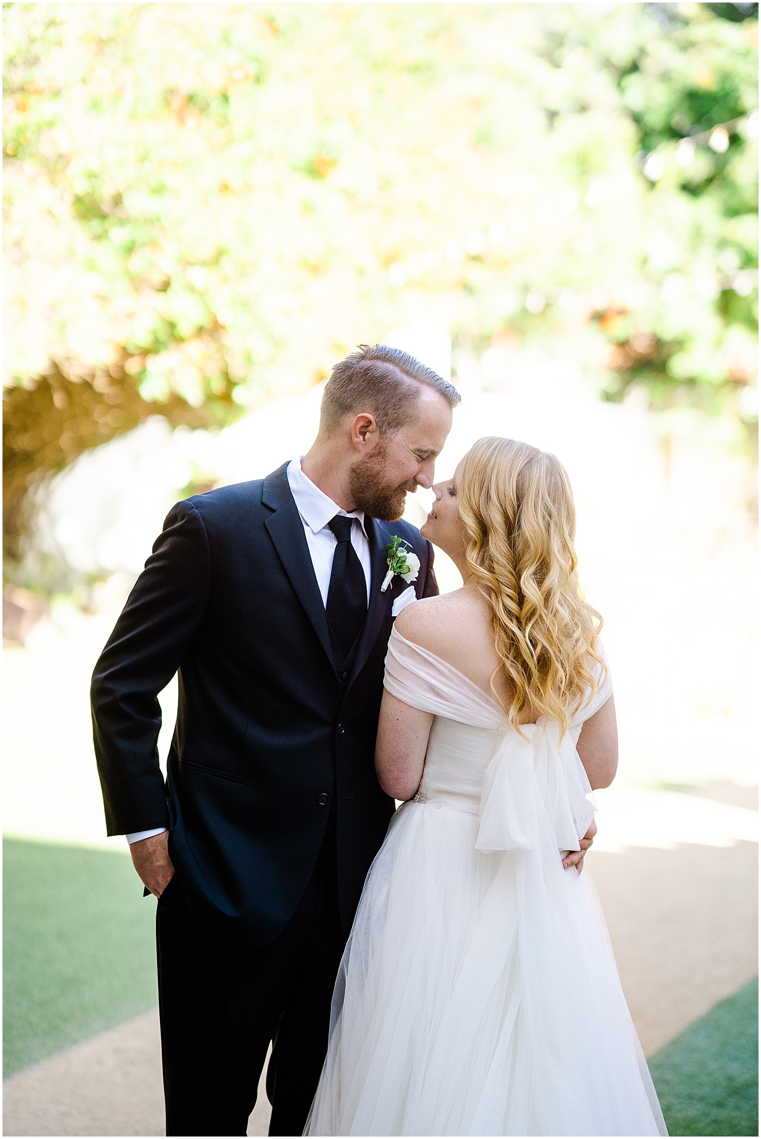 Casino San Clemente Wedding, Bride and Groom leaning in for a kiss